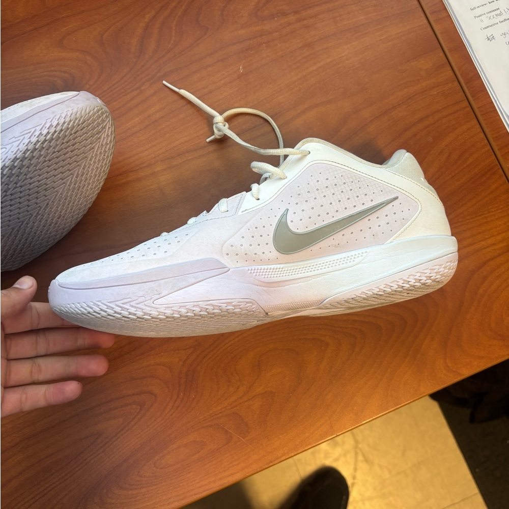 Nike White Low-Top Basketball Sneaker with Grey Swoosh